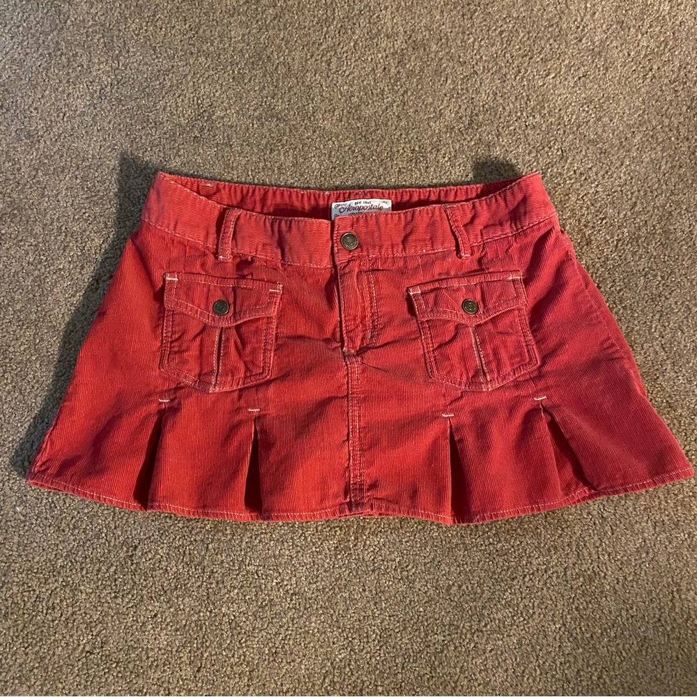 Low rise pink corduroy pleated mini skirt